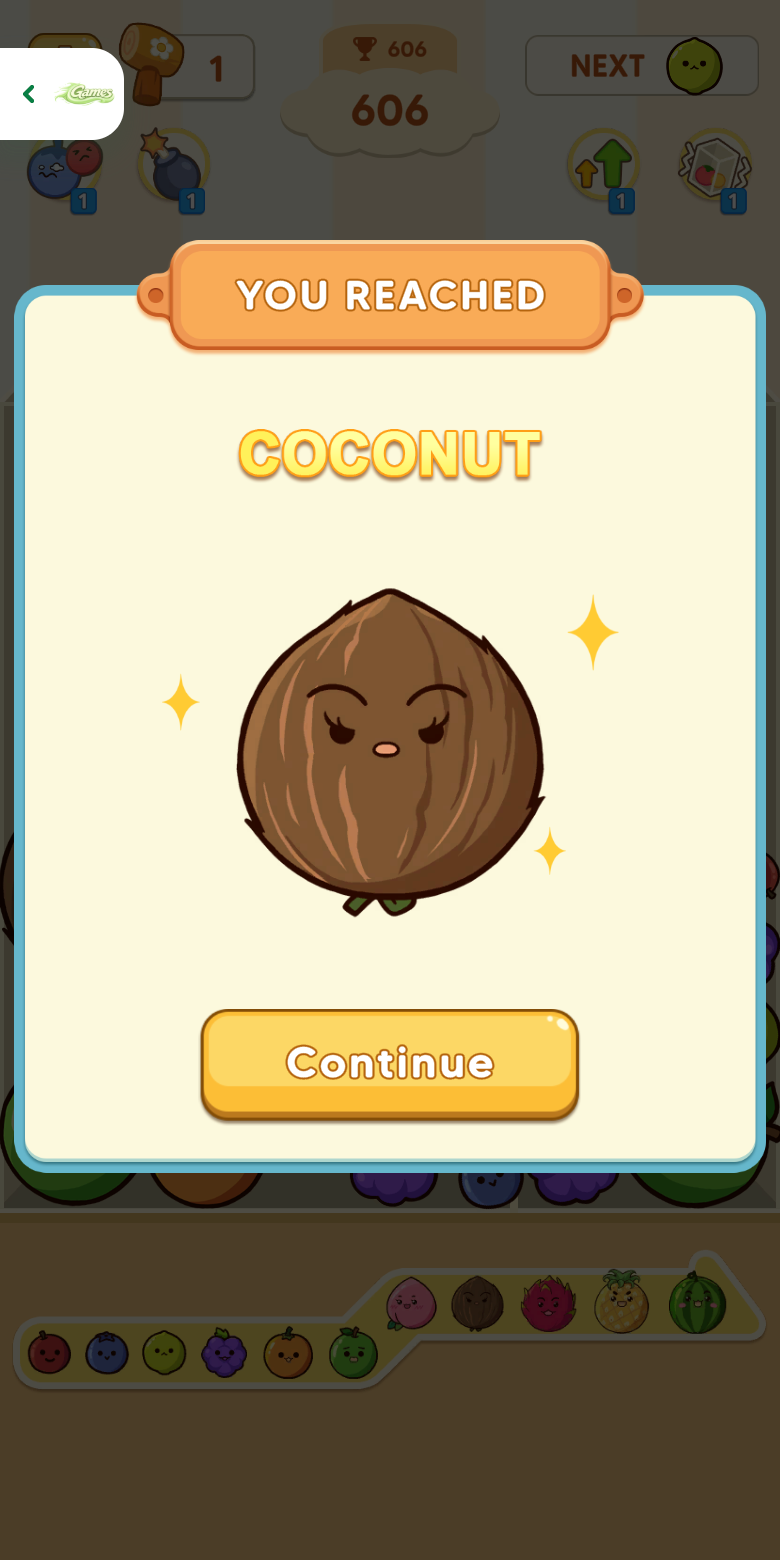 Fruit Merge mobile milestone panel announcing Coconut at score 606 with the Playflaming fullscreen back control visible