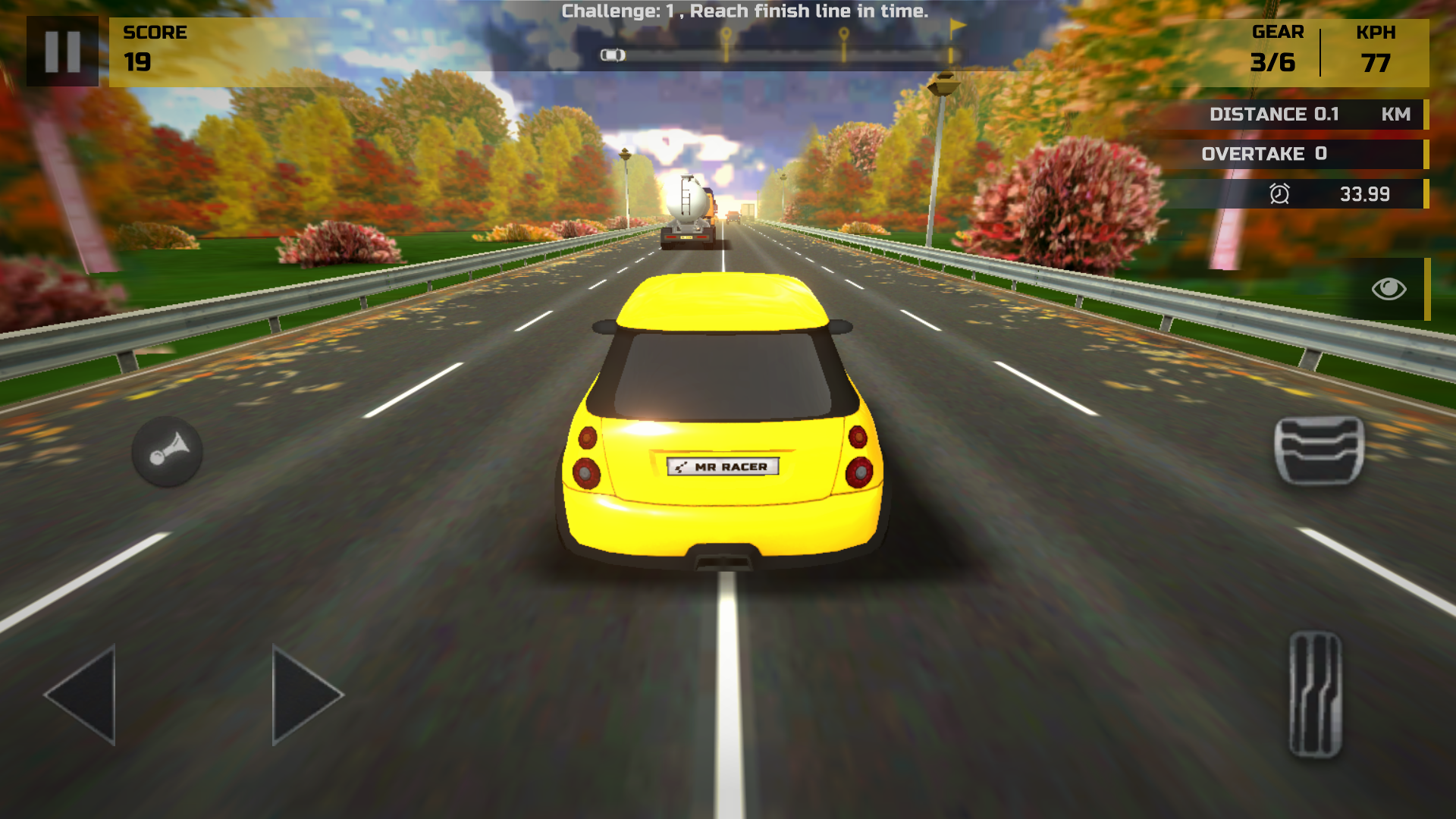 Yellow MR RACER car at 77 KPH in gear 3 on the autumn highway behind a tanker