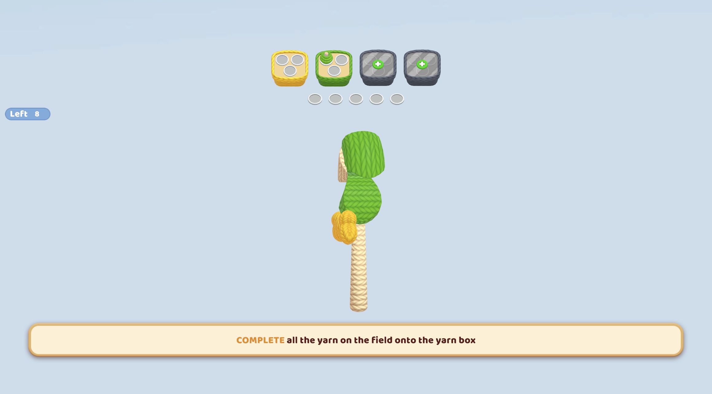 Yarn Fever lollipop rotated sideways to expose green, yellow, and cream yarn sections